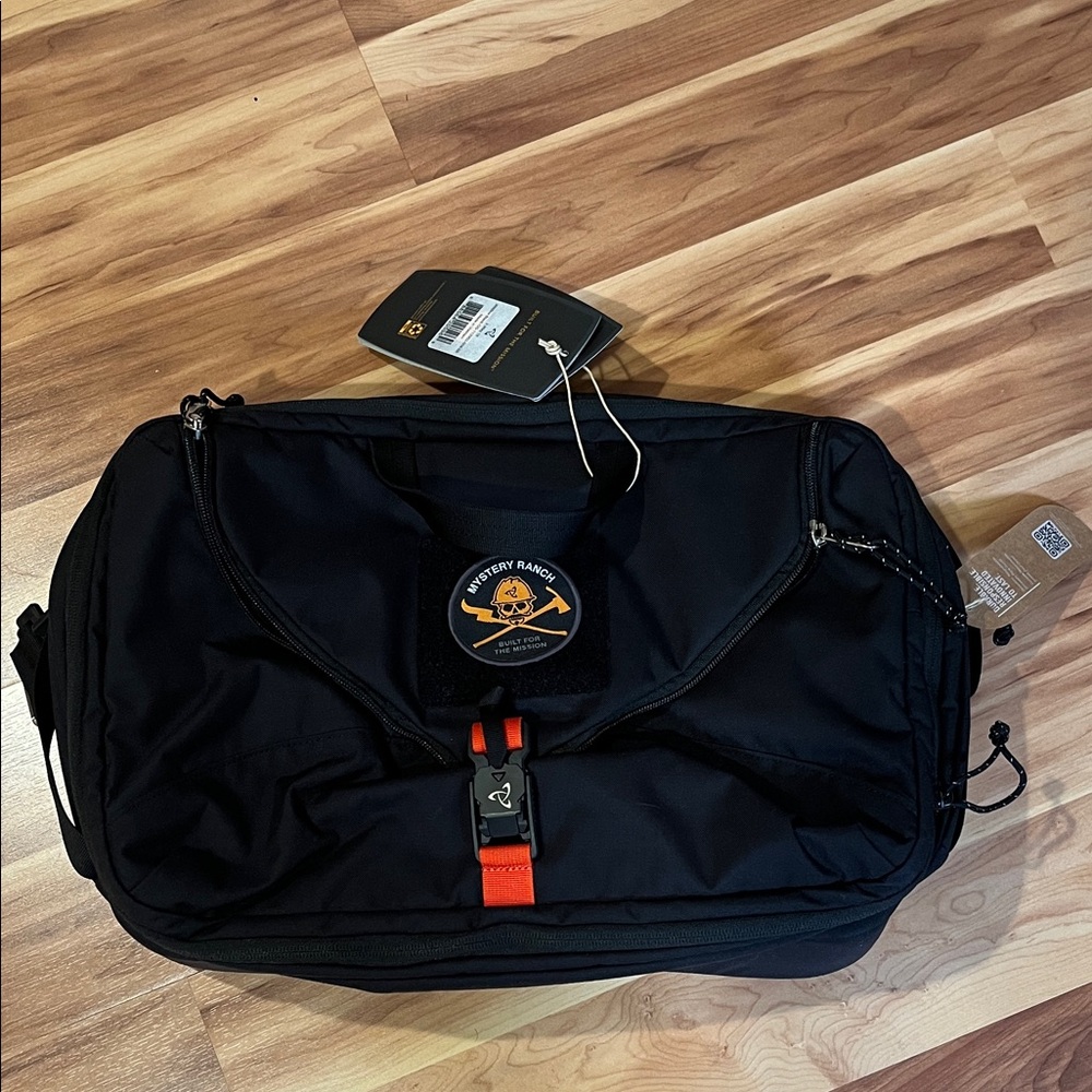 Mystery Ranch Black Duffel Bag with Orange Accent